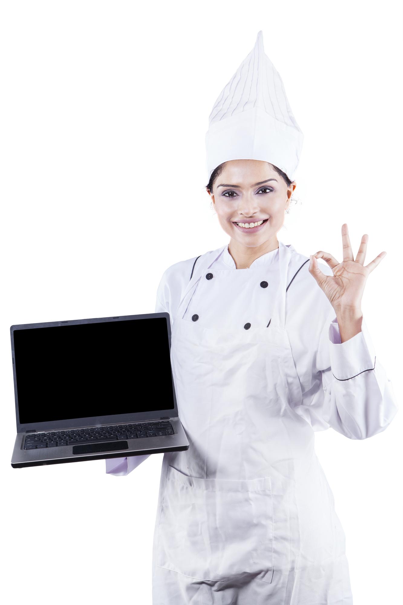 Chef che accoglie studenti davanti alla cucina